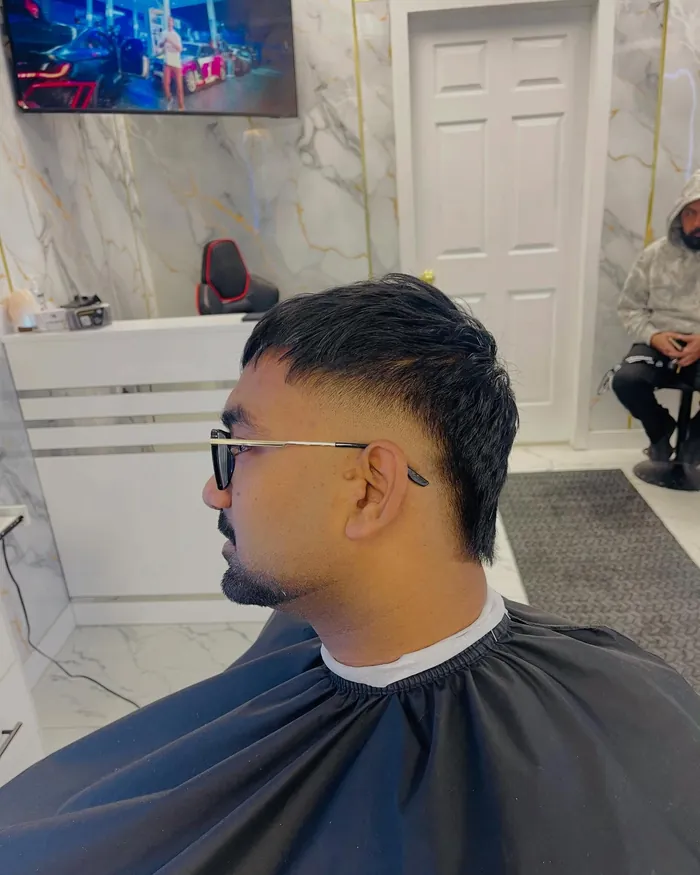 Client with a fresh skin fade at CUTCREW